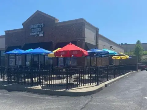 Crewitts Creek patio with colorful umbrellas